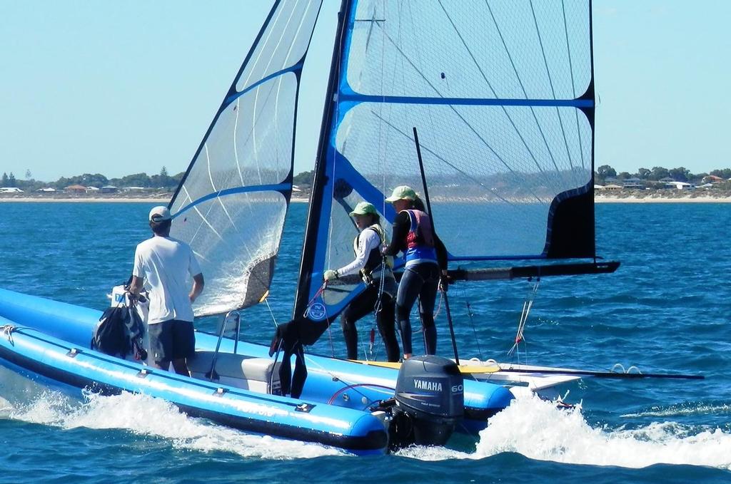 Fast learners – Monique de Vries and Danielle Carr listen intently to the advice of visiting skiff coach and 2008 49er World Champion Ben Austin on how to improve their FX skills. © Annette Walker